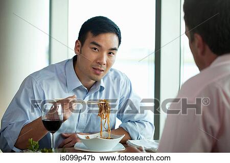 Businessman eating noodles View Large Photo Image Stock Image - Businessman eating noodles. Fotosearch