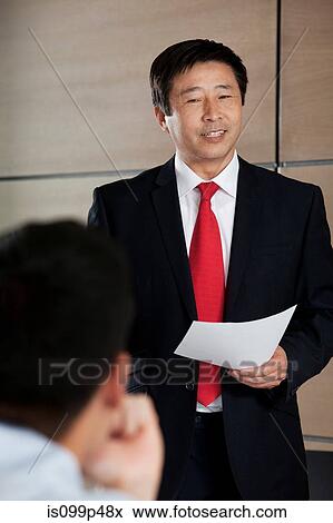 Businessman giving presentation View Large Photo Image Stock Photo - Businessman giving presentation. Fotosearch