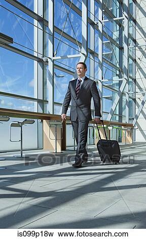 Businessman in airport View Large Photo Image Stock Photo - Businessman in airport. Fotosearch