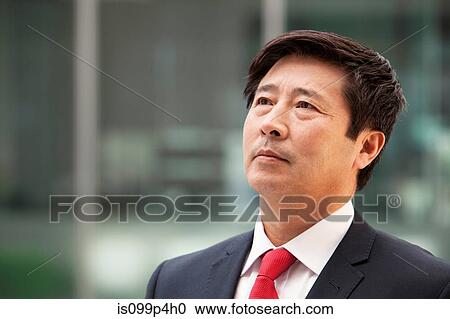 Businessman looking up, portrait View Large Photo Image Stock Image - Businessman looking up, portrait. Fotosearch