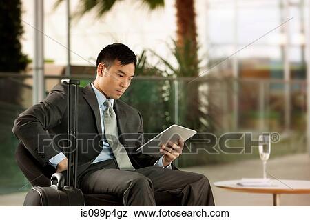 Stock Photo - Businessman with digital tablet. Fotosearch