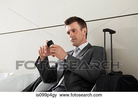 Stock Photo - Businessman with smart phone. Fotosearch