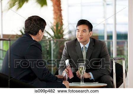 Businessmen with airline tickets and passports View Large Photo Image Stock Image - Businessmen with airline tickets and passports. Fotosearch