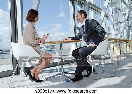 Businesspeople sitting in airport View Large Photo Image Stock Image - Businesspeople sitting in airport. Fotosearch
