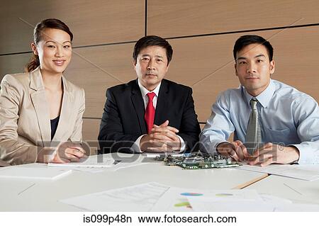 Businesspeople with circuit board, portrait View Large Photo Image Picture - Businesspeople with circuit board, portrait. Fotosearch