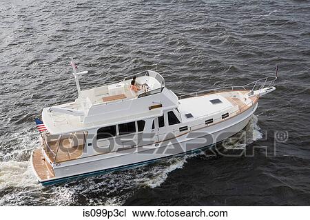 Couple on power boat, aerial view View Large Photo Image Stock Image - Couple on power boat, aerial view. Fotosearch