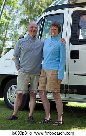 Couple outside campervan, portrait View Large Photo Image Stock Image - Couple outside campervan, portrait. Fotosearch