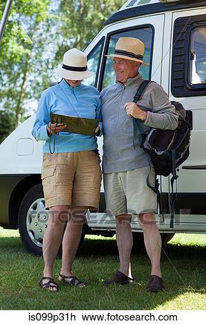 Couple outside campervan with backpack View Large Photo Image Stock Image - Couple outside campervan with backpack. Fotosearch