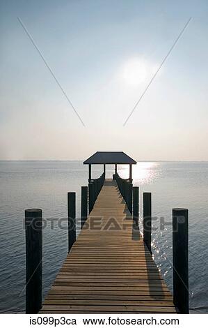 Stock Image - Empty pier in sea. Fotosearch