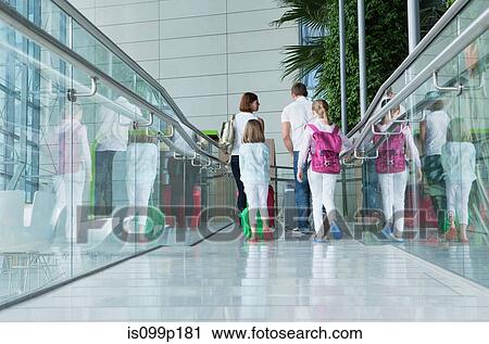 Family in airport with luggage View Large Photo Image Stock Image - Family in airport with luggage. Fotosearch