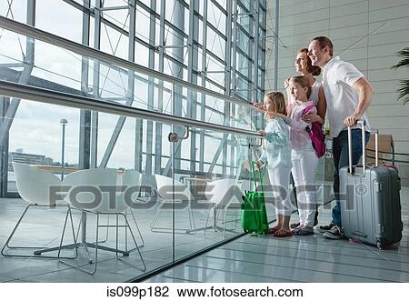 Family in airport with luggage View Large Photo Image Stock Image - Family in airport with luggage. Fotosearch