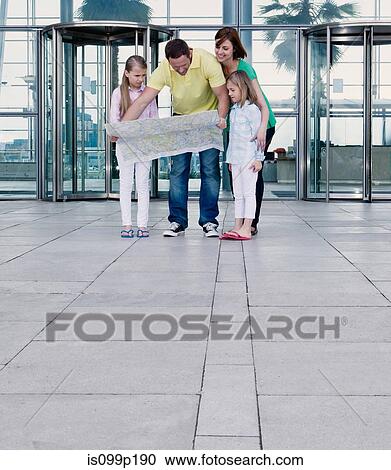 Family with map outside airport View Large Photo Image Stock Image - Family with map outside airport. Fotosearch