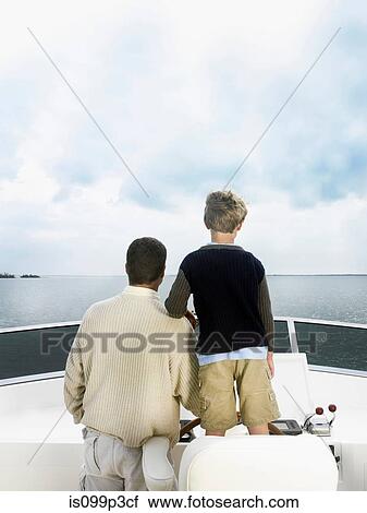 Father and son on boat View Large Photo Image Stock Image - Father and son on boat. Fotosearch