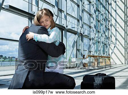 Father arriving in airport with daughter View Large Photo Image Stock Photo - Father arriving in airport with daughter. Fotosearch