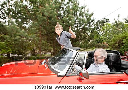Grandfather and grandson driving in vintage car View Large Photo Image Stock Photography - Grandfather and grandson driving in vintage car. Fotosearch