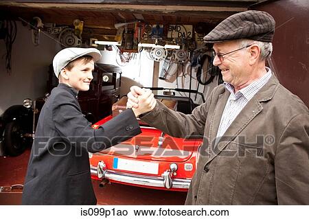 Grandfather and grandson shaking hands View Large Photo Image Picture - Grandfather and grandson shaking hands. Fotosearch