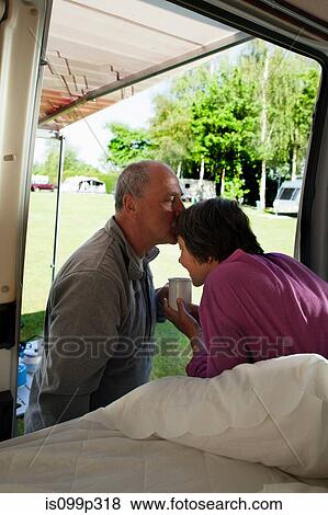 Man kissing woman in camper van View Large Photo Image Stock Photo - Man kissing woman in camper van. Fotosearch