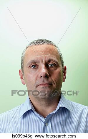 Mature male teacher looking at camera View Large Photo Image Stock Image - Mature male teacher looking at camera. Fotosearch