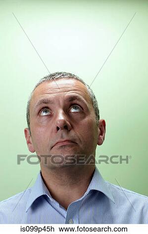 Mature male teacher looking up View Large Photo Image Stock Image - Mature male teacher looking up. Fotosearch
