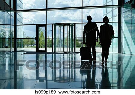 Mid adult couple at airport View Large Photo Image Stock Photo - Mid adult couple at airport. Fotosearch