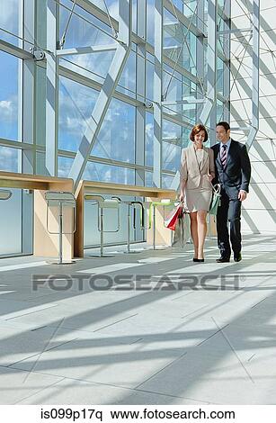 Mid adult couple in airport View Large Photo Image Stock Photography - Mid adult couple in airport. Fotosearch