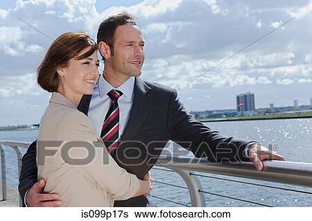 Mid adult couple outside airport View Large Photo Image Stock Photograph - Mid adult couple outside airport. Fotosearch