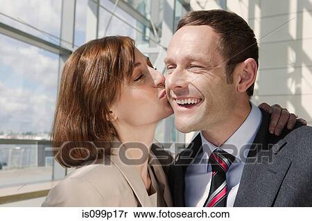 Mid adult couple, woman kissing man on cheek View Large Photo Image Stock Photography - Mid adult couple, woman kissing man on cheek. Fotosearch