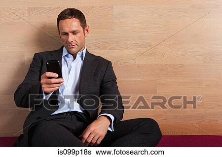 Mid adult man texting, portrait View Large Photo Image Stock Photograph - Mid adult man texting, portrait. Fotosearch