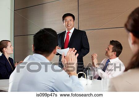 Stock Photograph - Multi racial business meeting. Fotosearch