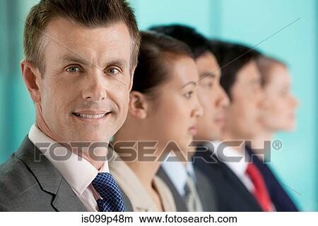 Multi racial businesspeople in a line, portrait View Large Photo Image Picture - Multi racial businesspeople in a line, portrait. Fotosearch