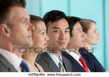 Multi racial businesspeople in a line, portrait View Large Photo Image Picture - Multi racial businesspeople in a line, portrait. Fotosearch