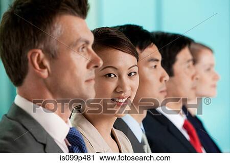 Multi racial businesspeople in a line, portrait View Large Photo Image Stock Image - Multi racial businesspeople in a line, portrait. Fotosearch