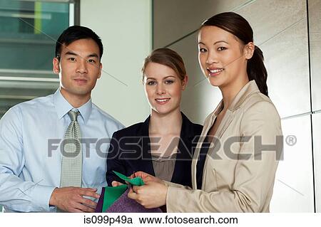 Multi racial businesspeople with colour swatches, portrait View Large Photo Image Stock Image - Multi racial businesspeople with colour swatches, portrait. Fotosearch