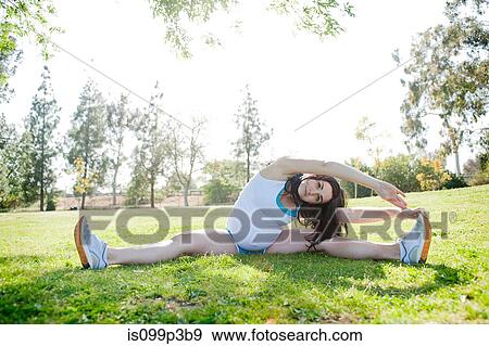 Pregnant young woman stretching to touch toes View Large Photo Image Stock Photo - Pregnant young woman stretching to touch toes. Fotosearch
