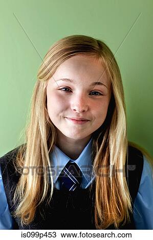 Stock Image - Schoolgirl smiling, portrait. Fotosearch