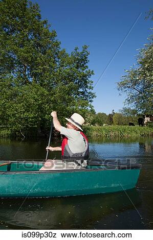 Stock Photo - Senior man kayaking. Fotosearch