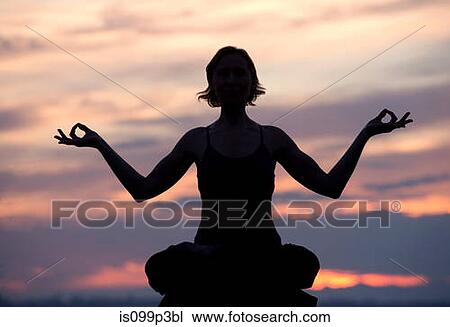 Silhouette of woman in lotus position at sunset View Large Photo Image Stock Image - Silhouette of woman in lotus position at sunset. Fotosearch