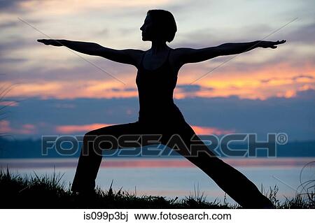 Silhouette of woman in warrior yoga pose at sunset View Large Photo Image Stock Image - Silhouette of woman in warrior yoga pose at sunset. Fotosearch