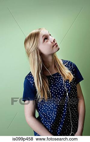 Teenage girl listening to mp3 player View Large Photo Image Stock Photo - Teenage girl listening to mp3 player. Fotosearch