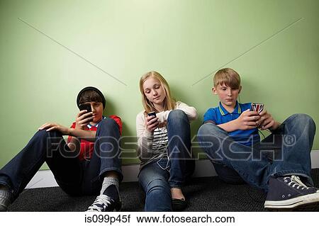 Three friends with mp3 players View Large Photo Image Stock Image - Three friends with mp3 players. Fotosearch