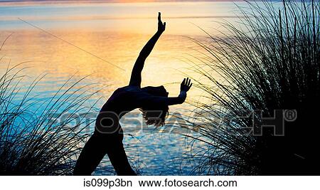Woman performing dance at sunset View Large Photo Image Picture - Woman performing dance at sunset. Fotosearch