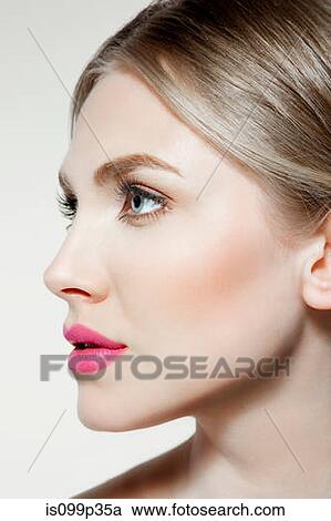 Stock Image - Young woman's face, portrait. Fotosearch