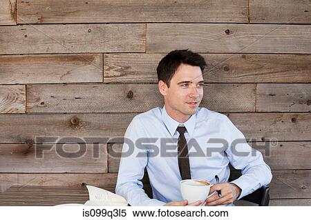 Businessman in cafe with coffee, portrait View Large Photo Image Stock Photography - Businessman in cafe with coffee, portrait. Fotosearch