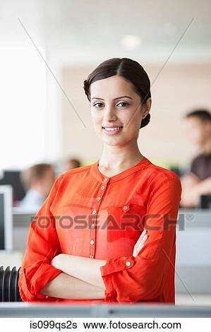 Stock Photograph - Businesswoman in office. Fotosearch
