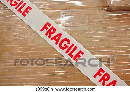 Stock Image - Cardboard box with parcel tape saying fragile. Fotosearch