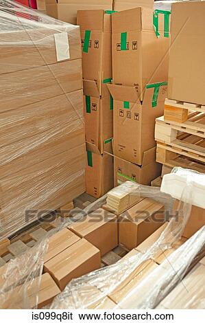 Cardboard boxes in warehouse View Large Photo Image Stock Photograph - Cardboard boxes in warehouse. Fotosearch