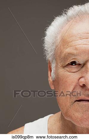 Picture - Contemplative senior man, close up portrait. Fotosearch
