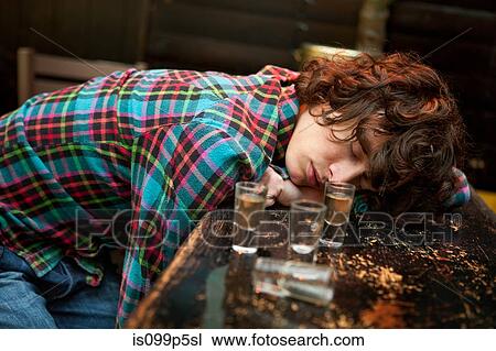 Drunk man slumped on bar asleep View Large Photo Image Stock Image - Drunk man slumped on bar asleep. Fotosearch
