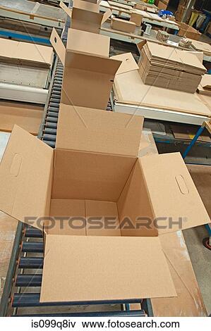 Empty cardboard boxes on conveyor belt View Large Photo Image Stock Photo - Empty cardboard boxes on conveyor belt. Fotosearch