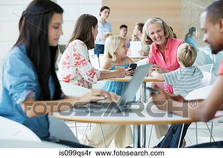 Family with grandmother in canteen area View Large Photo Image Stock Photography - Family with grandmother in canteen area. Fotosearch
